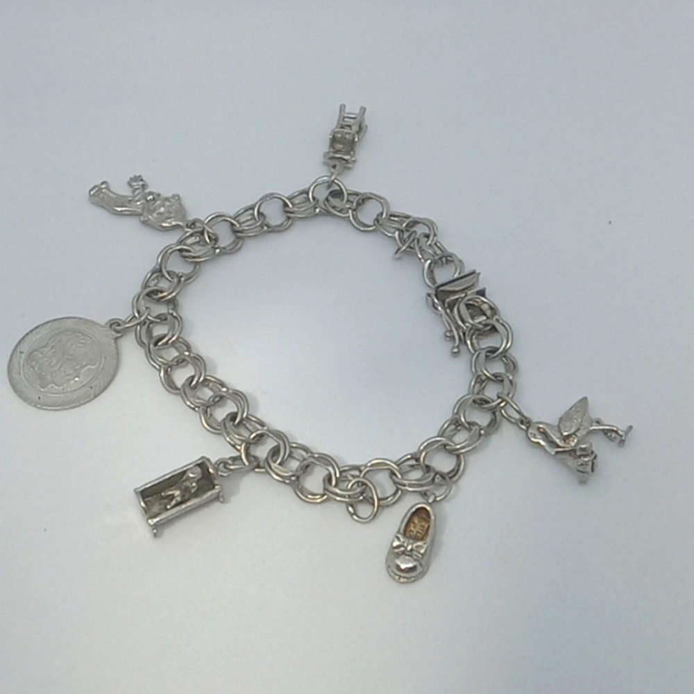 Mother's charm bracelet/ sterling silver with 6 baby related charms EUC